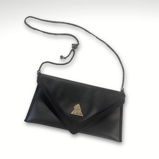 A black faux leather clutch bag with a geometric pattern on the front and an adjustable metal handle.
