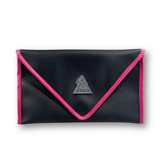 Black envelope clutch bag with pink trim and silver triangle logo; El Clásica Noire Rose clutch by t•Ana Couture displayed on a light background.