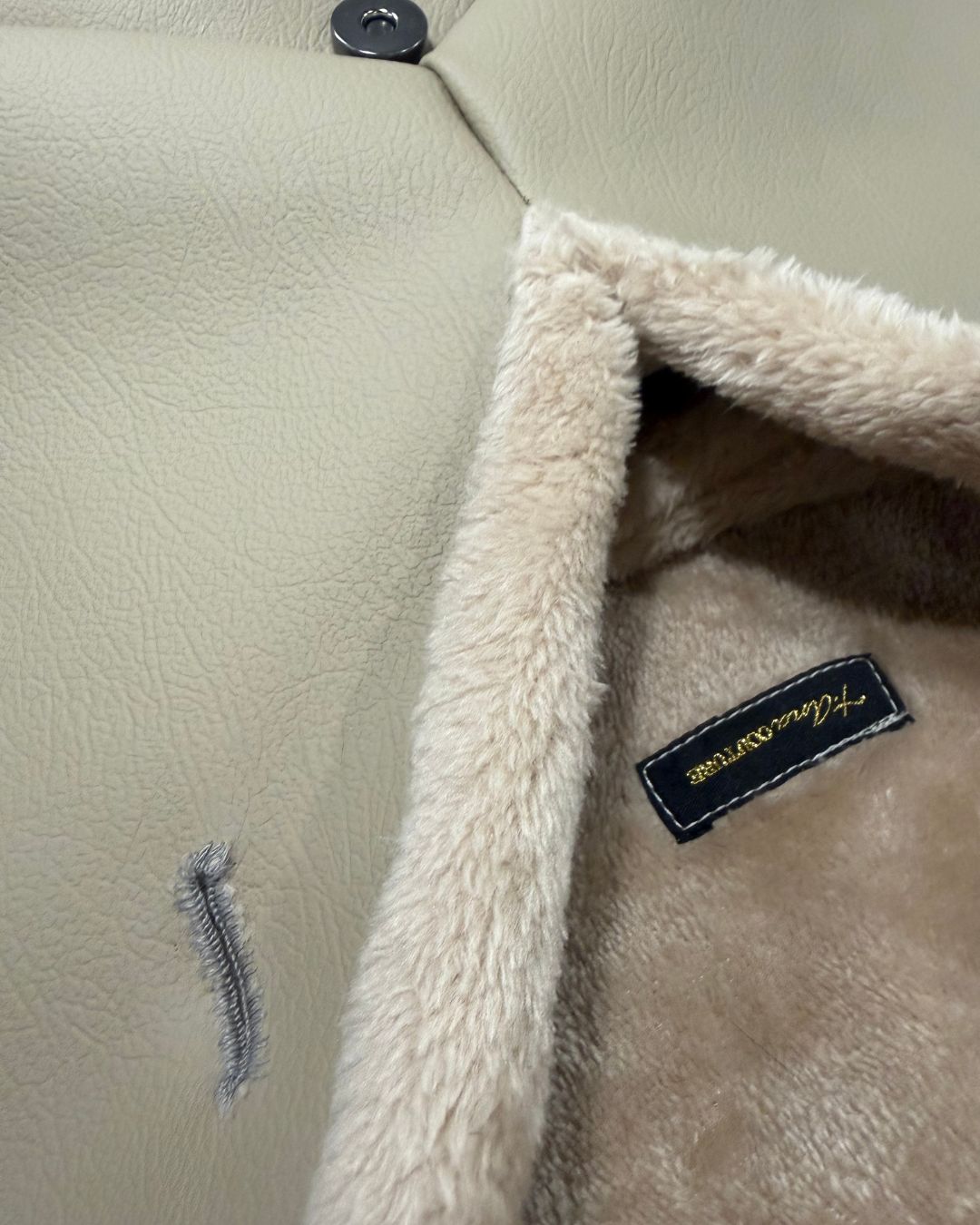 Plush sand-toned faux-fur trim and interior detail on Amara Sabbia clutch bag; soft vegan materials by t•Ana Couture