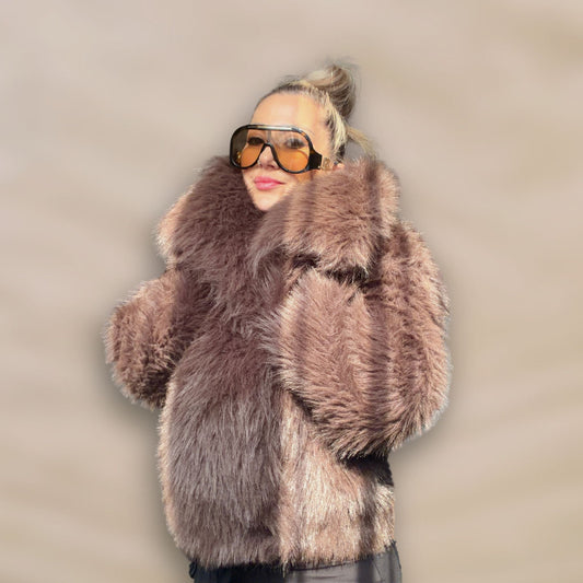 Soft brown faux fur coat featuring natural wooden buttons and practical pockets; a plush, cosy and elegant neutral outerwear piece for women, designed for slow luxury winter styling and refined day to evening looks. This warm, timeless coat elevates everyday outfits with texture, comfort and effortless sophistication.