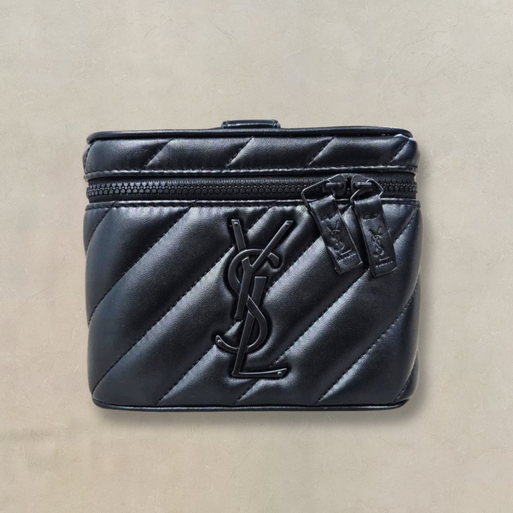 YSL Beauté VIP black vanity bag, styled view