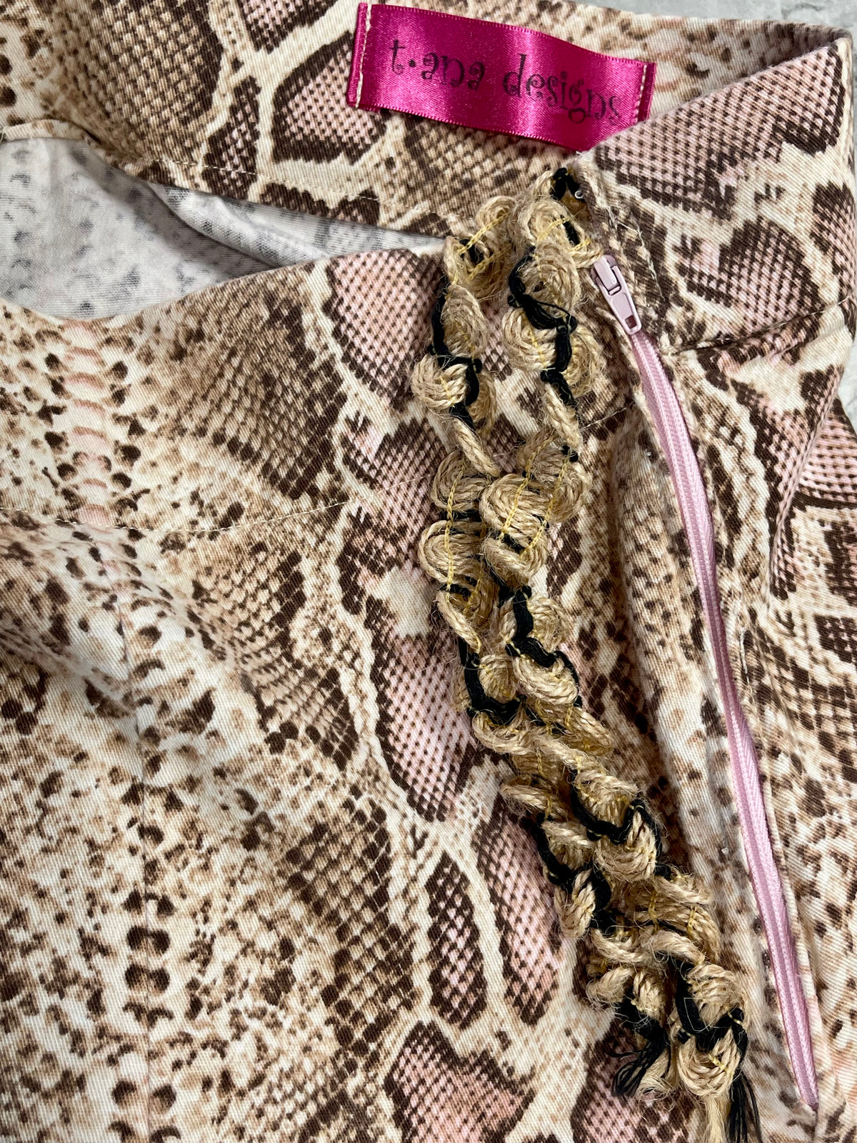 Sacred Venom blush snake-print set, detail view