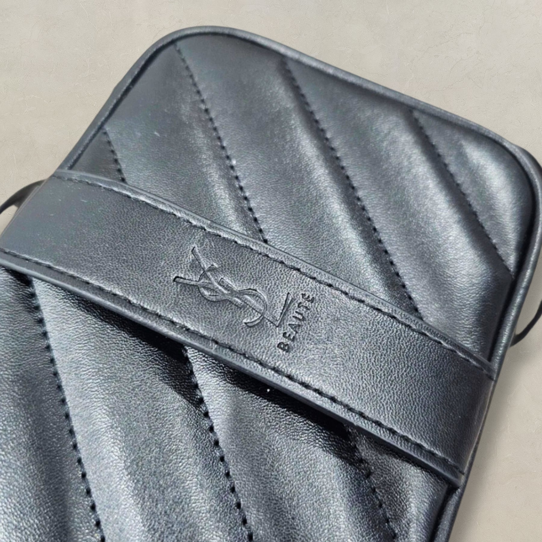 YSL Beauté VIP black crossbody, styled view