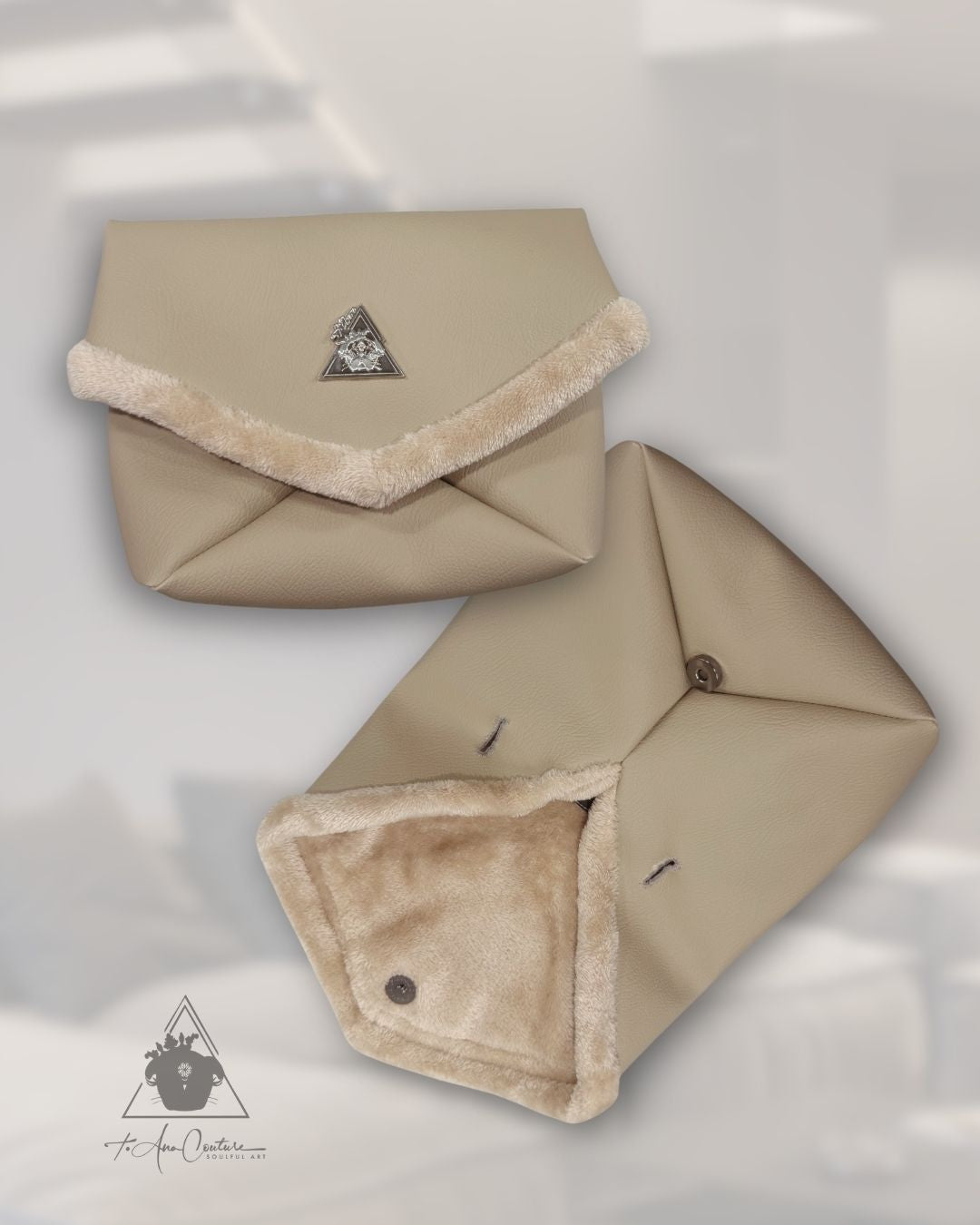 Two beige fabric envelopes with fur trim on a light gray background. luxury lifestyle. Amara Sabbia Petite clutch handbag in beige vegan leather with silver logo plate and soft faux-fur trim with belt strap or handle; Mediterranean Muse Eternal Bond Series by t•Ana Couture.