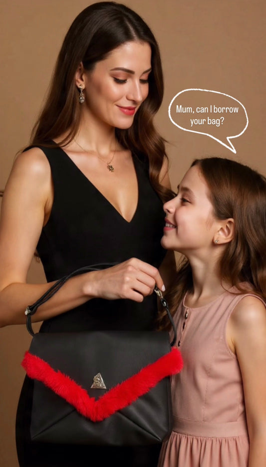 Amara Rossa Grande & Petite Duo: Luxurious vegan red leather mother-daughter handbags with signature triangle emblem, plush reversible interiors, and matching styles shown on model and child against neutral background—handcrafted by t.Ana Couture in Cyprus for timeless elegance.