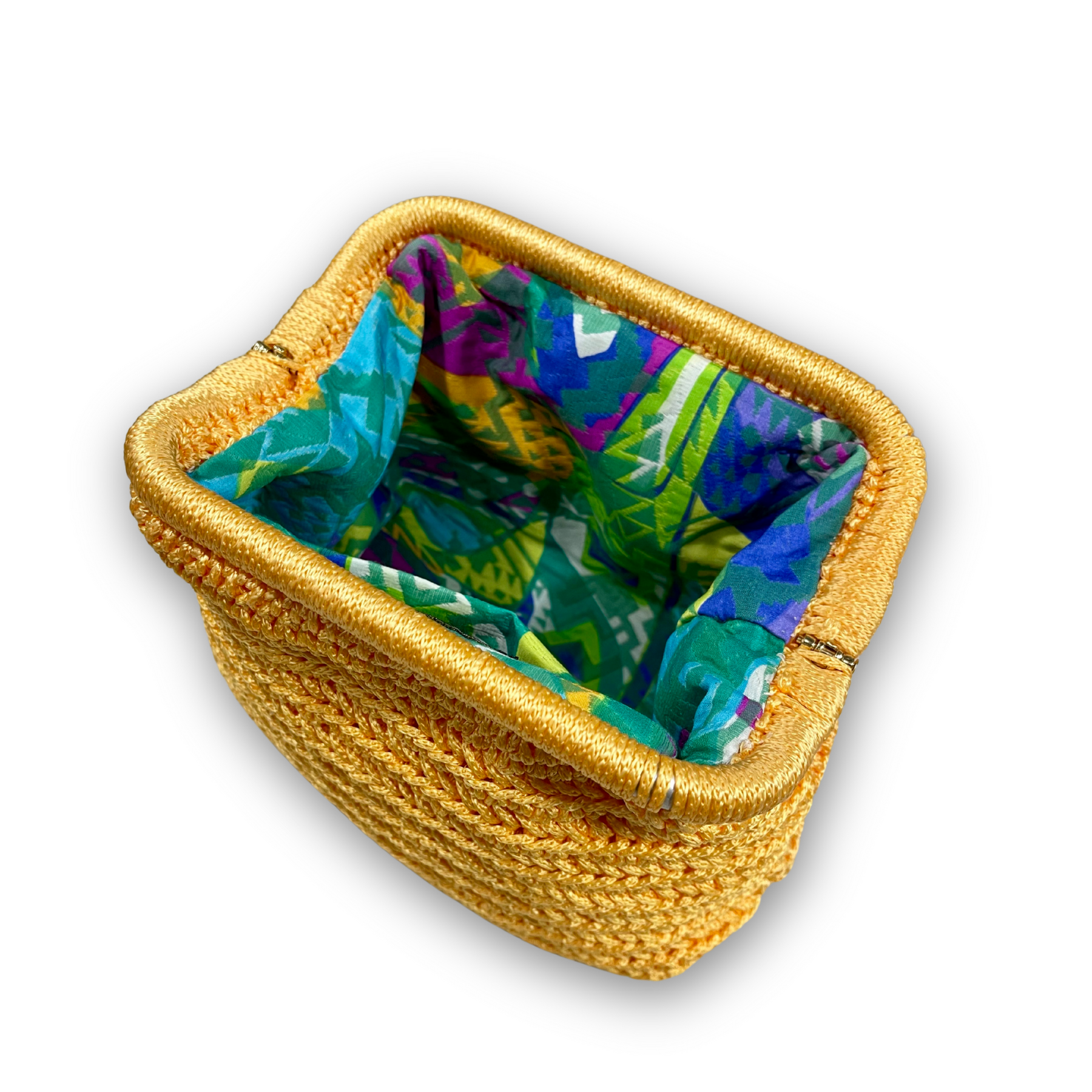 Aurora Sole hand-knit clutch, styled view