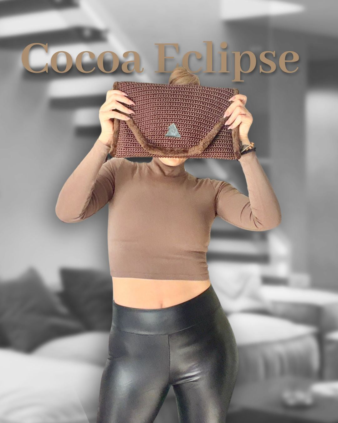 Cocoa Eclipse hand-knit clutch in black-and-white editorial styling