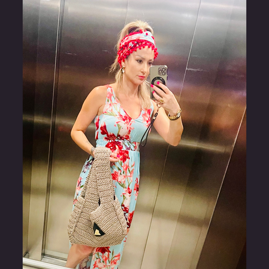 Happy Valley blue floral summer dress with red pom-pom detail