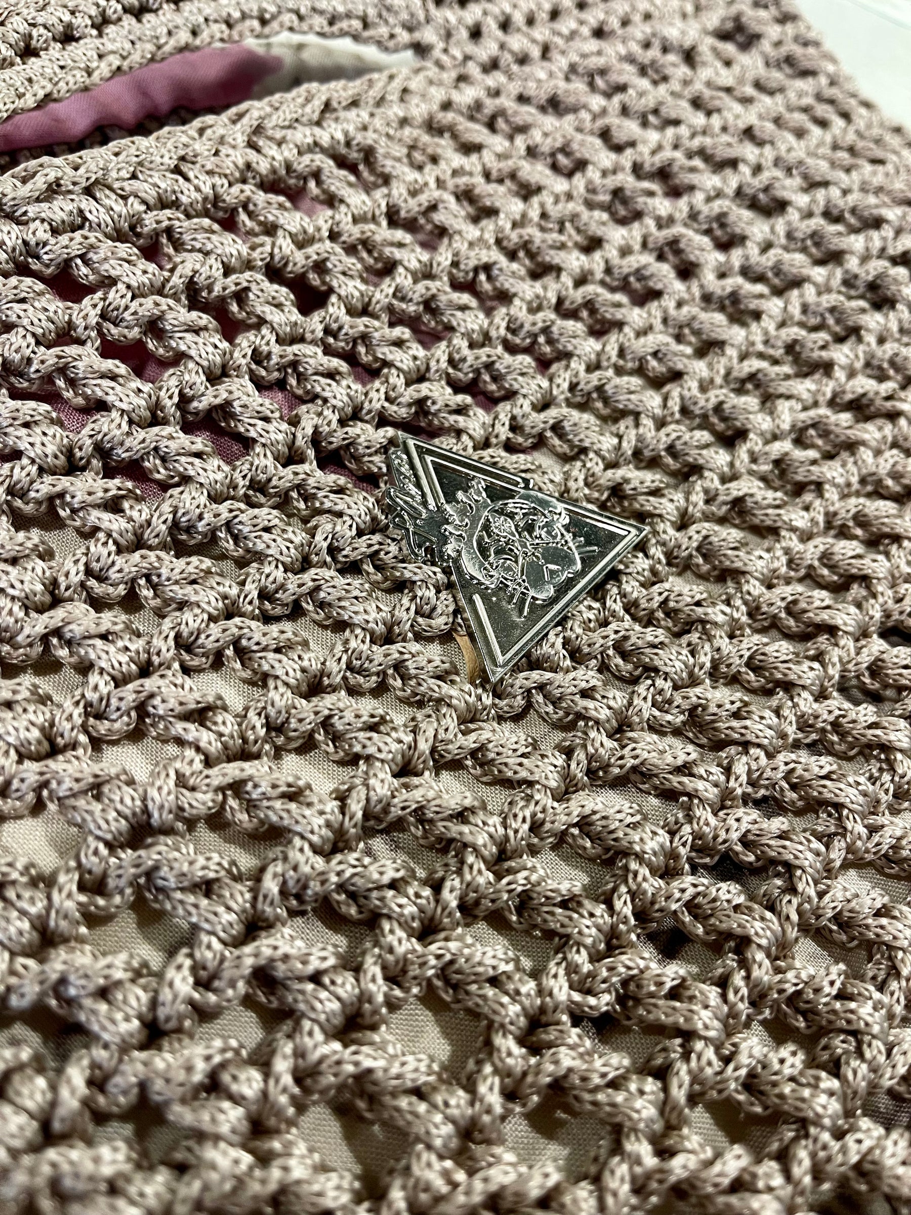 Mystic Mocha Bloom silver-tone emblem detail