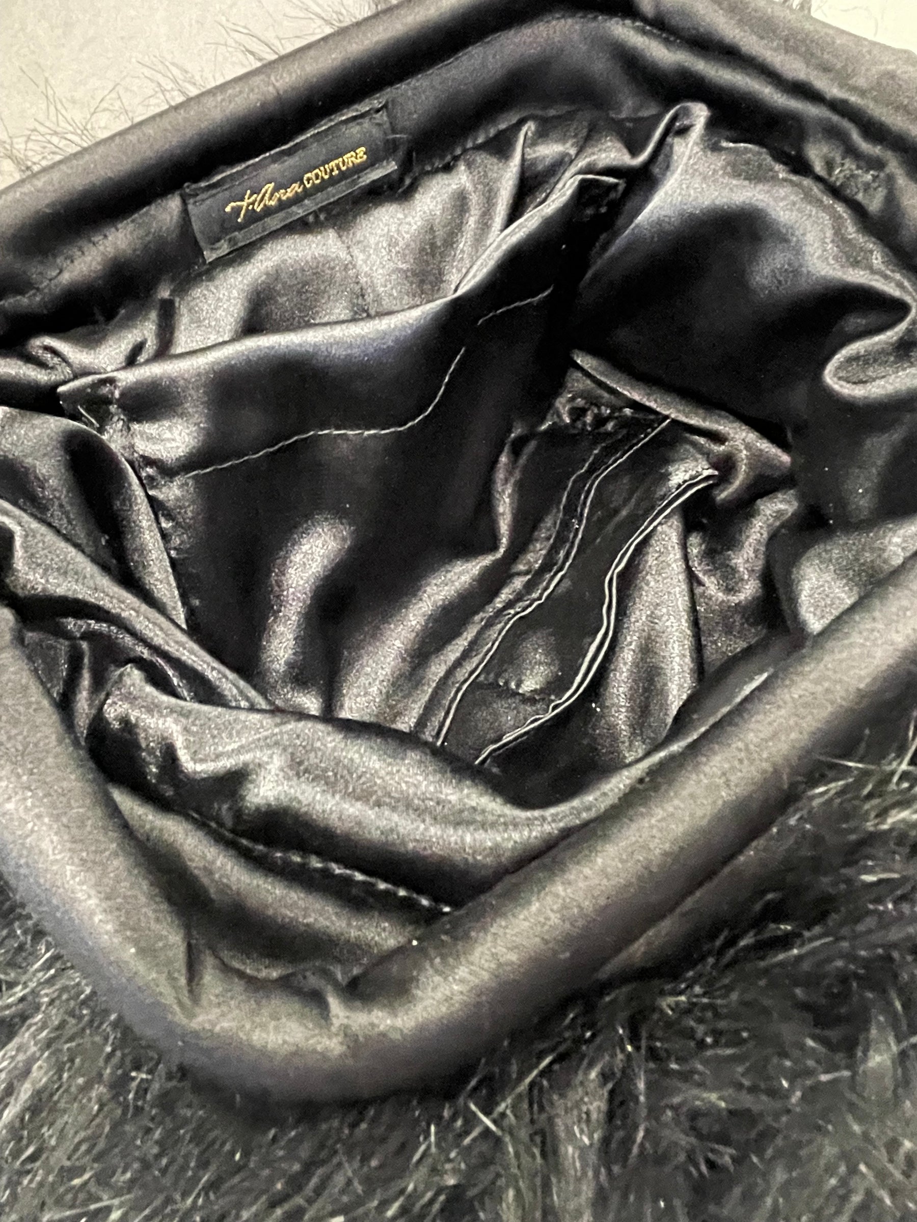 Phoenix Noir faux-fur clutch, detail view
