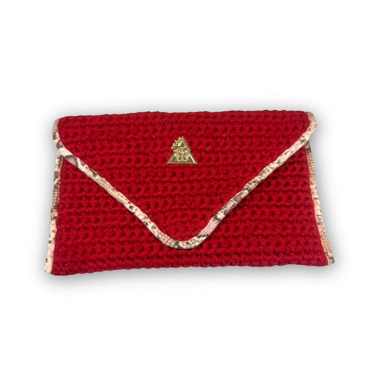 Sacred Venom Magenta hand-knit clutch, styled view