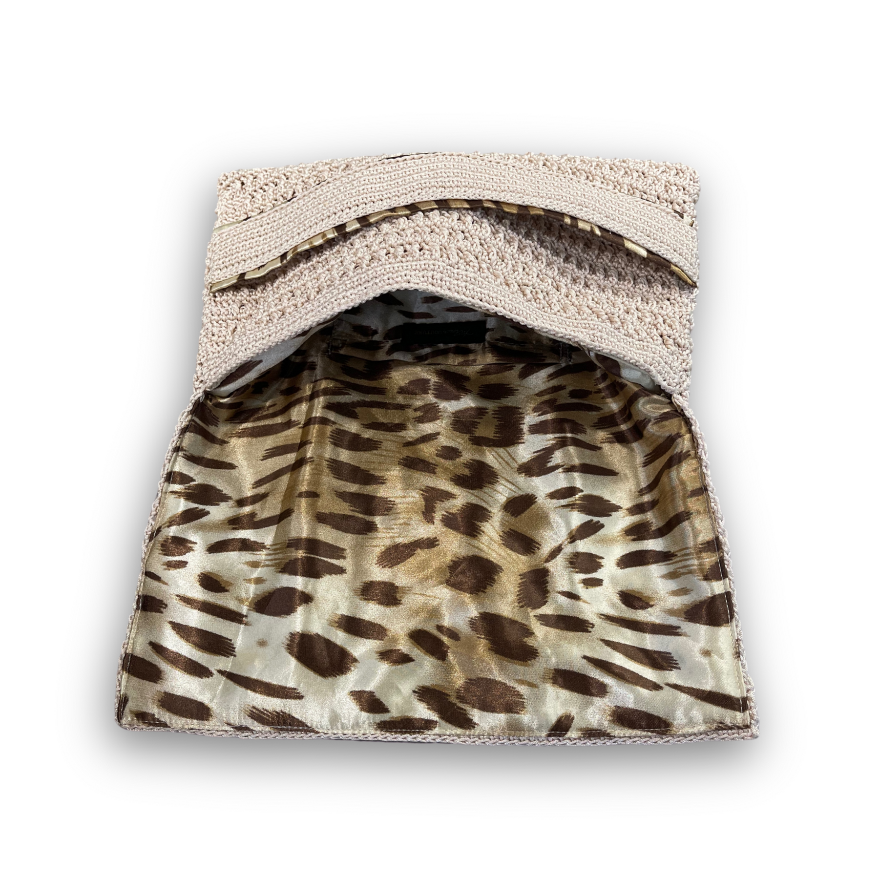 Savanna Mirage beige hand-knit clutch, styled view