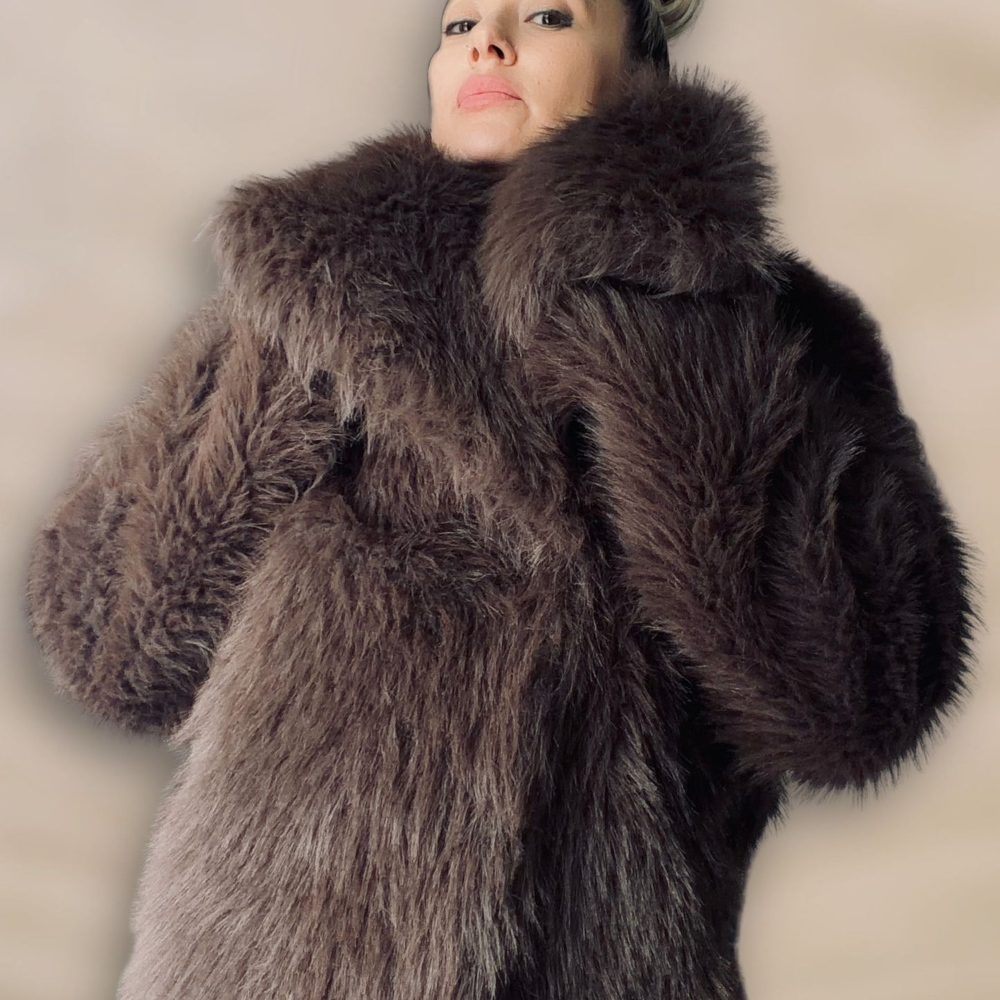 Soft brown faux fur coat featuring natural wooden buttons and practical pockets; a plush, cosy and elegant neutral outerwear piece for women, designed for slow luxury winter styling and refined day to evening looks. This warm, timeless coat elevates everyday outfits with texture, comfort and effortless sophistication.