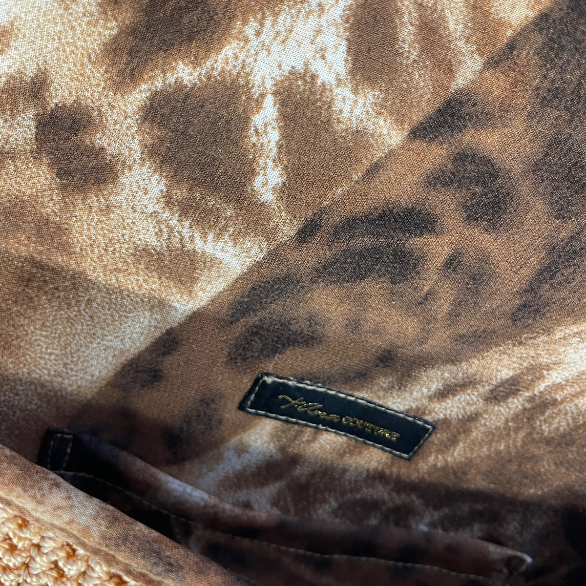 Thalassa Auria warm-gold clutch, styled view