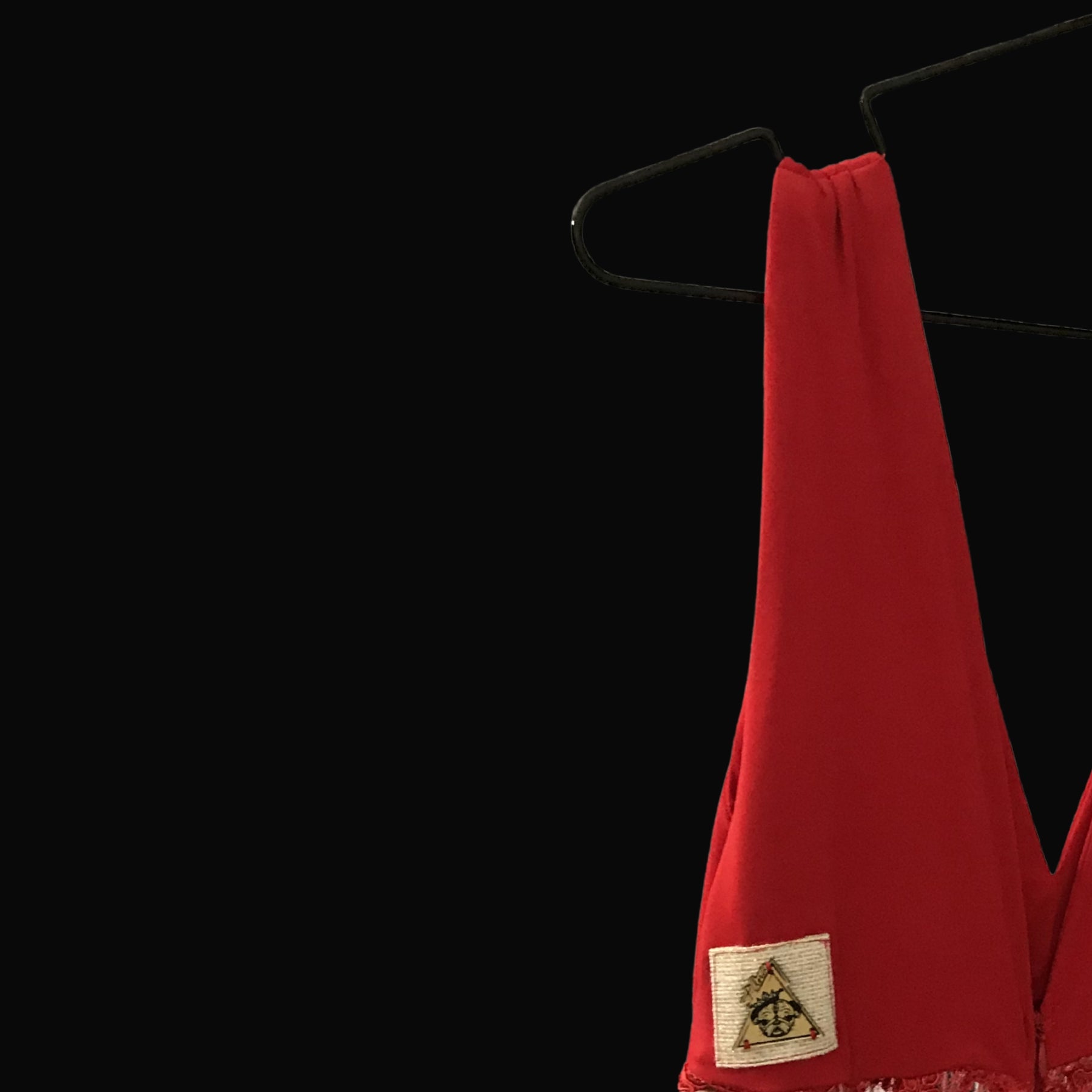 Vestito Rosso Ardente red evening gown with t•Ana Couture emblem detail