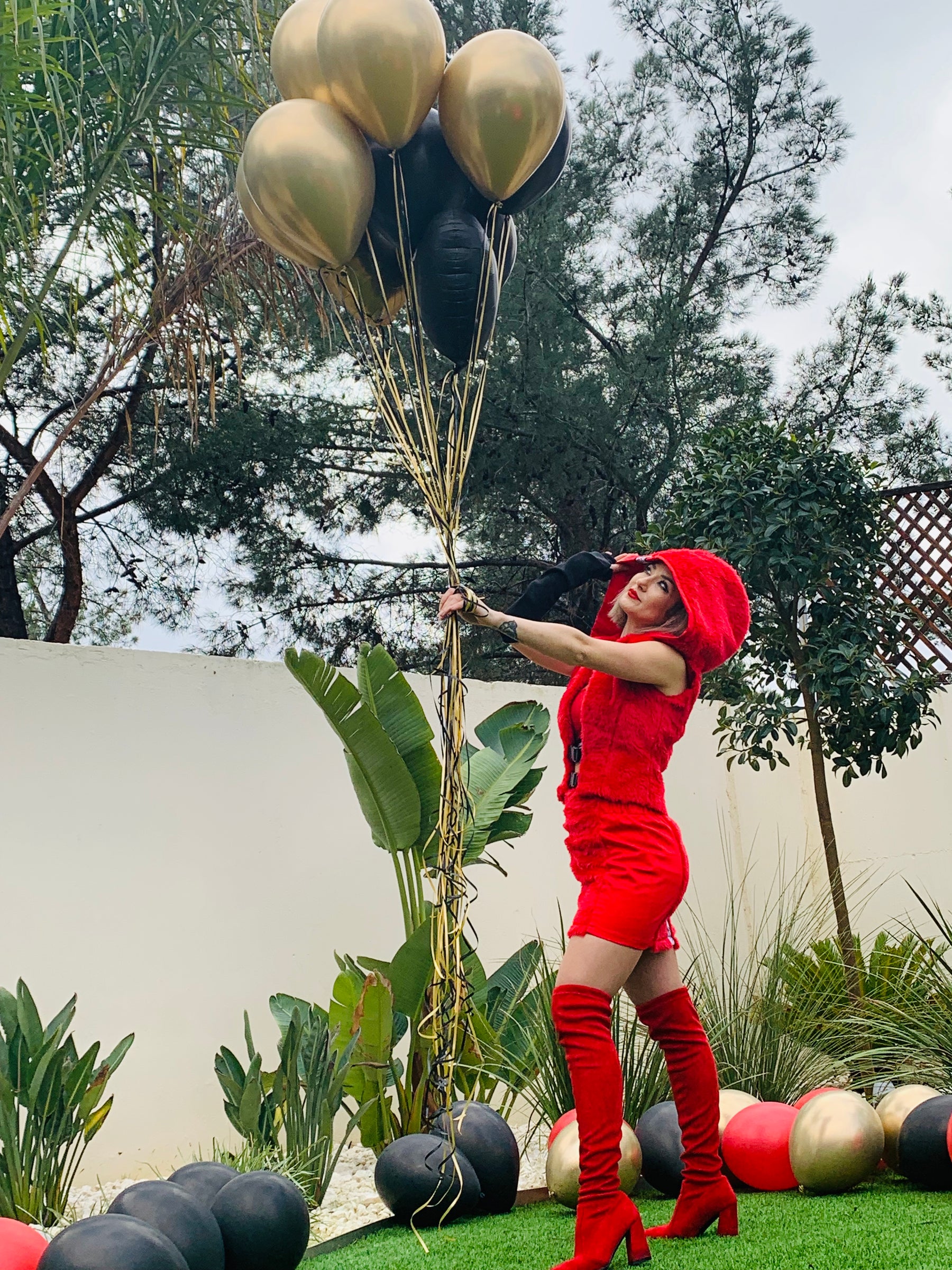 La Passione Rossa red hooded vest and mini skirt, styled view