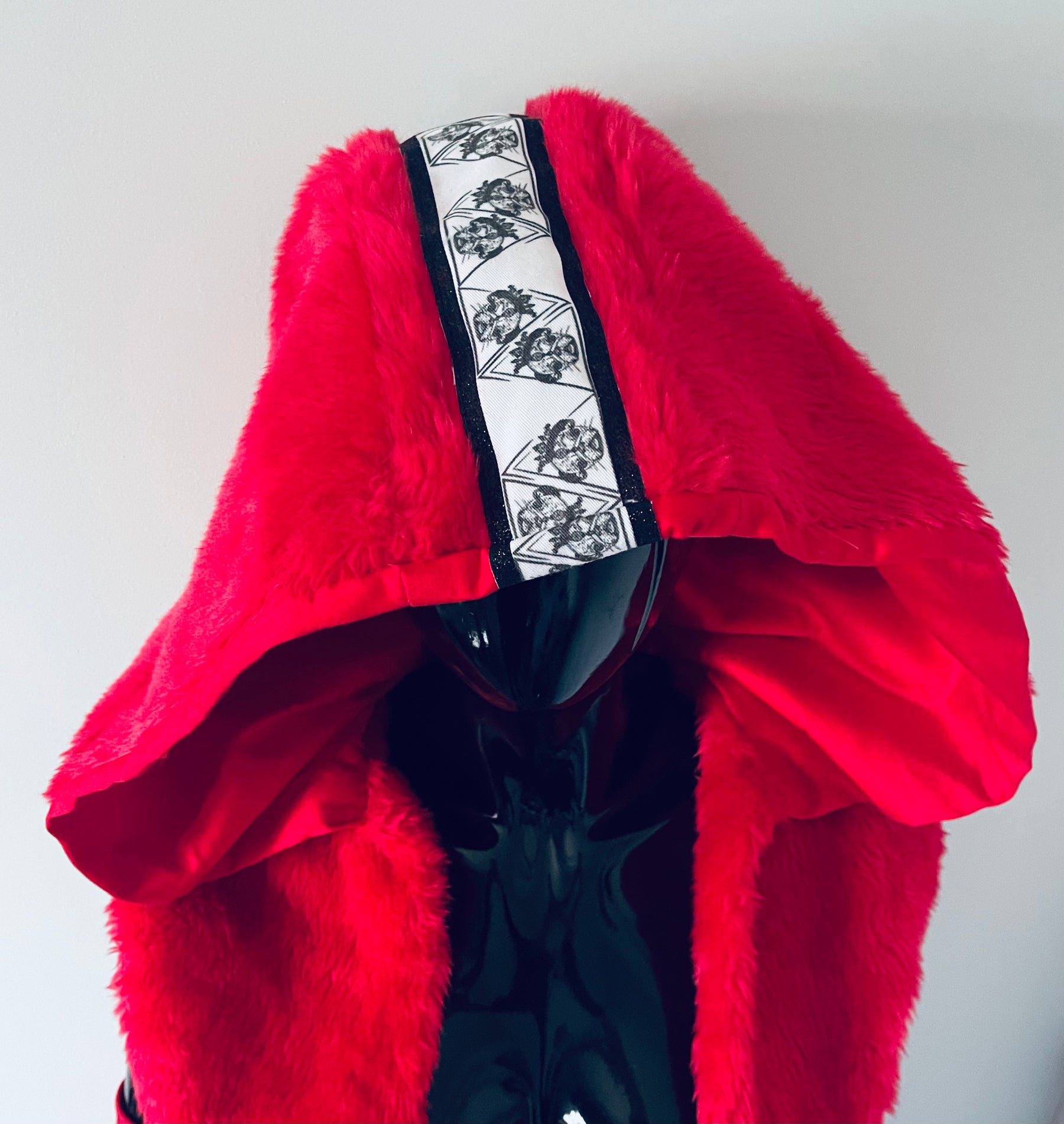 La Passione Rossa red hooded vest and skirt, detail view