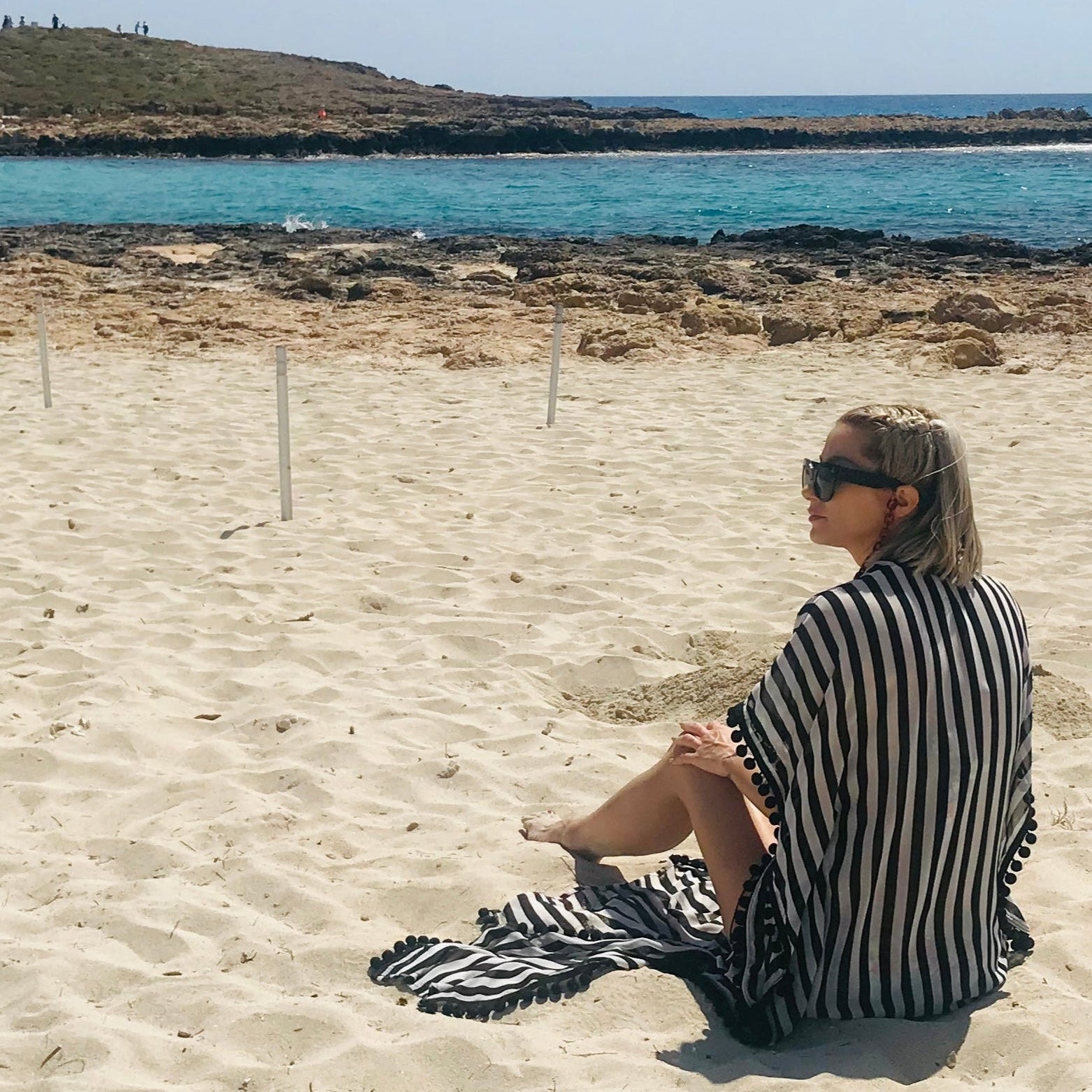 Utopia caftan with black pom-pom trim, styled view